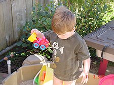 Hunter playing in his sand box.