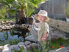 Hunter pets the Blue Heron decoy.