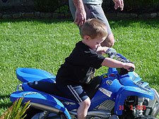 Hunter riding his ATV