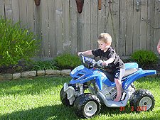 Hunter riding his ATV