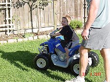 Hunter riding his ATV