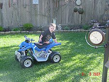 Hunter riding his ATV