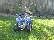 Hunter riding his ATV