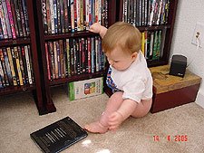 Checking out his movie selection.