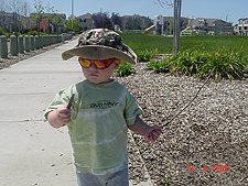 Hunter finds sticks while he walks to the park...