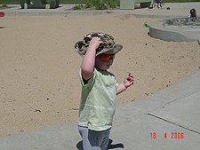Hunter putting sticks in his hat.