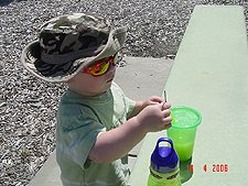 Hunter sticks twigs in his straw.
