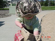 Hunter looking for snacks in his backpack.