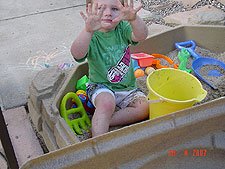 Hunter playing in his sand box.