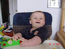 Showing his two top teeth.