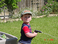 Hunter playing with the hose.