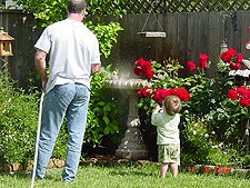 Hunter thinks he's helping by spraying with his spray bottle.