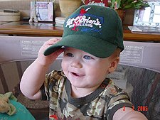 Hunter wearing daddy's hat.