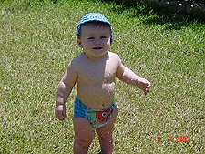 Hunter getting sprayed with the hose.