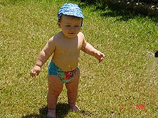 Hunter getting sprayed with the hose.