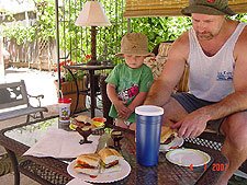 Enjoying BBQd burgers & sausages.