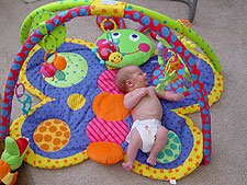 Hunter on his butterfly mat.
