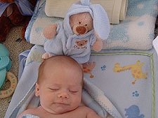 Napping with his new bear.