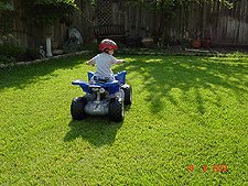 Hunter riding his ATV.
