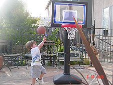 Hunter shooting baskets.