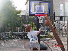 Hunter shooting baskets.