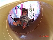 Hunter going down the slide.