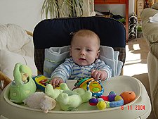 Hunter trying out the highchair.