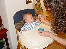 Hunter gets his first solid food.