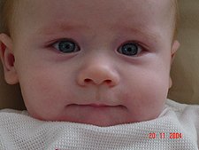 Showing daddy a smile in hopes he will give him his bean bag.