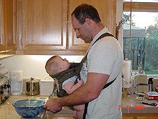 Hunter looks at daddy in amazement as he discovers he is the real muffin man.