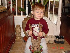 Hunter trying to ride the reindeer.