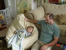 Hunter cuddles up to watch TV on his beanbag.