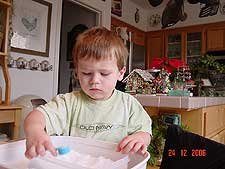 Hunter playing with snow