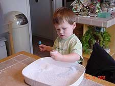 Hunter playing with snow