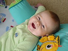 Lying on his pillow.