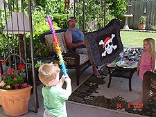 Hunter takes a swing at the pinata