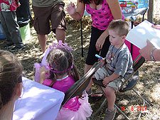 Olivia opens her gifts.