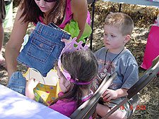 Olivia opens her gifts.