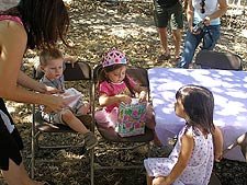 Hunter watches Olivia open gifts