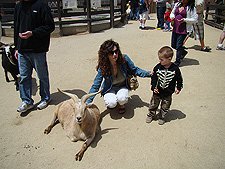 Heidi and Hunter with a goat
