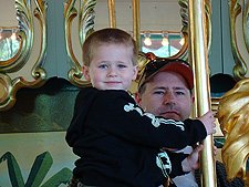 Dave and Hunter on the carousel