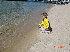 Hunter drawing in the sand