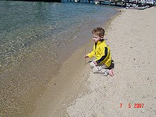 Hunter drawing in the sand