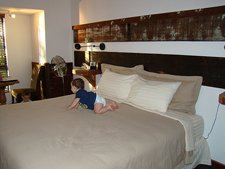 Ryder on the bed and Hunter playing on the floor.