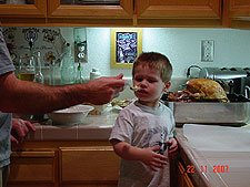 Hunter testing the mashed potatos.